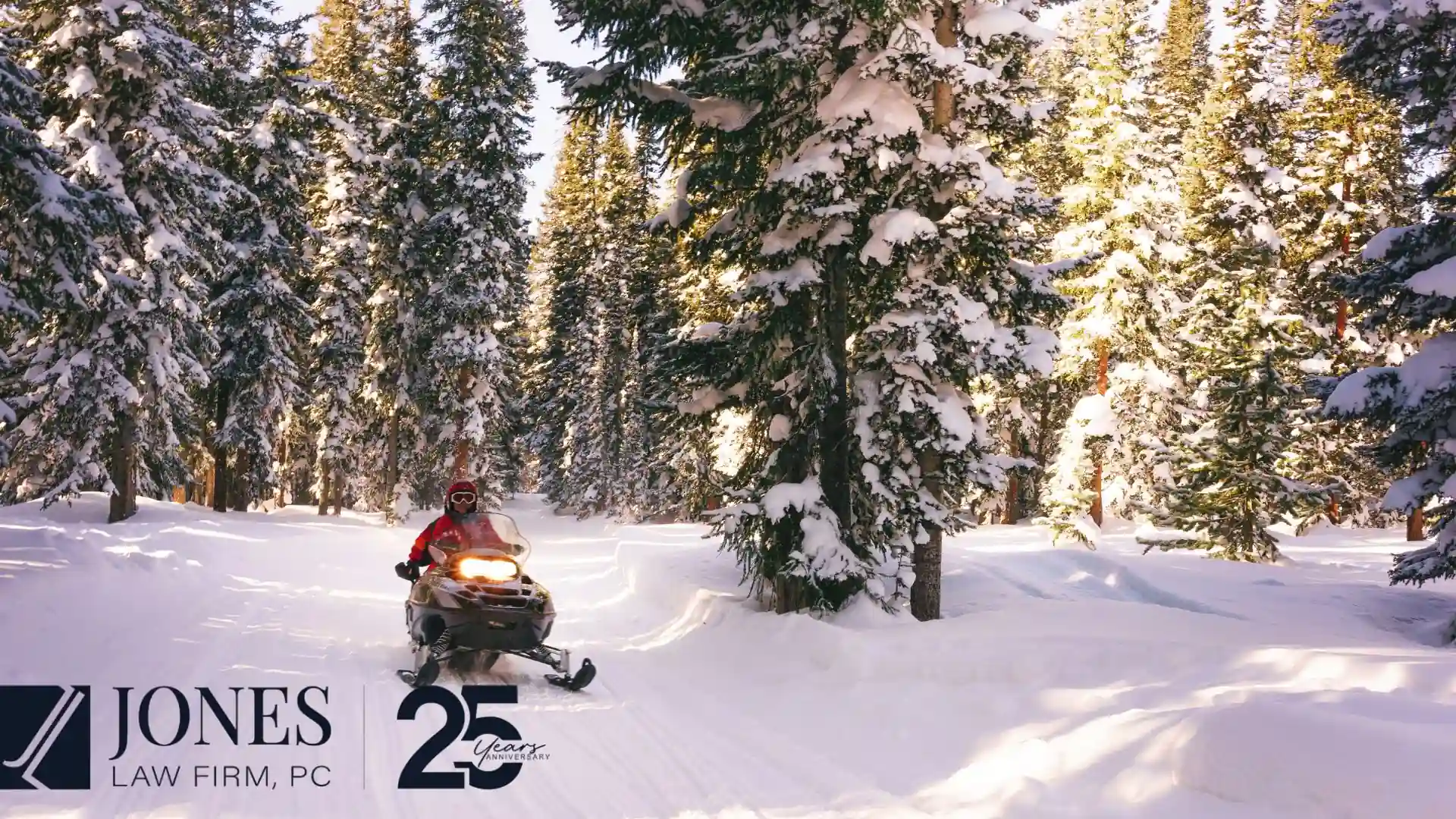 A man riding s Snow mobile through a snowy wooded landscape in Colorado, where a growing population need child support services.