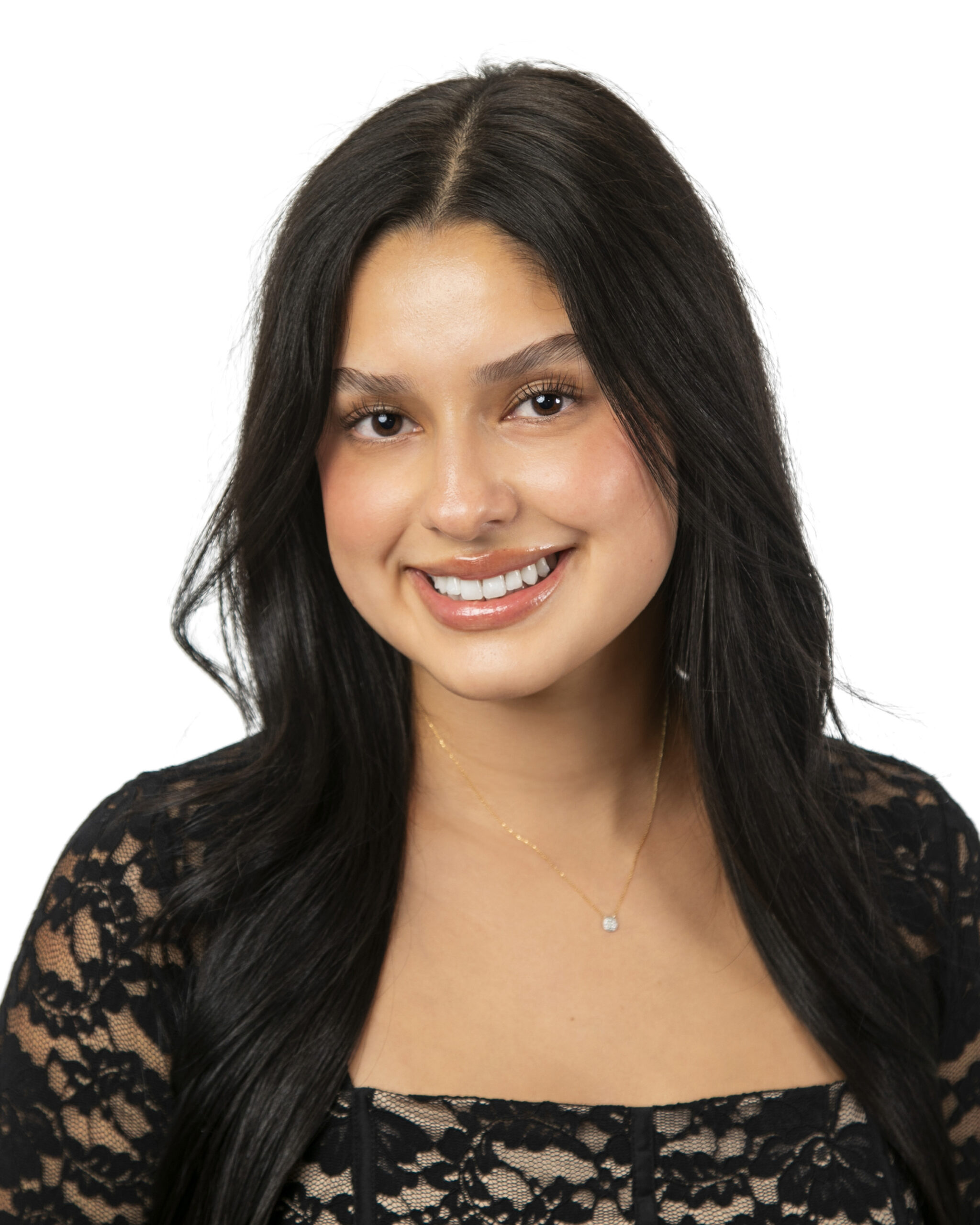 Smiling woman with long dark hair in black lace top