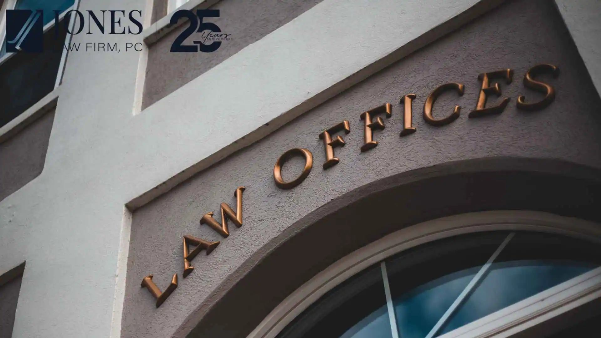 Law offices building entrance with firm anniversary logo